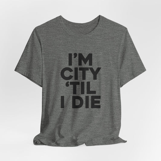 Manchester City FC team slogan T-shirt featuring the phrase 'I'm City 'til I Die' in bold text, expressing unwavering fan loyalty and dedication