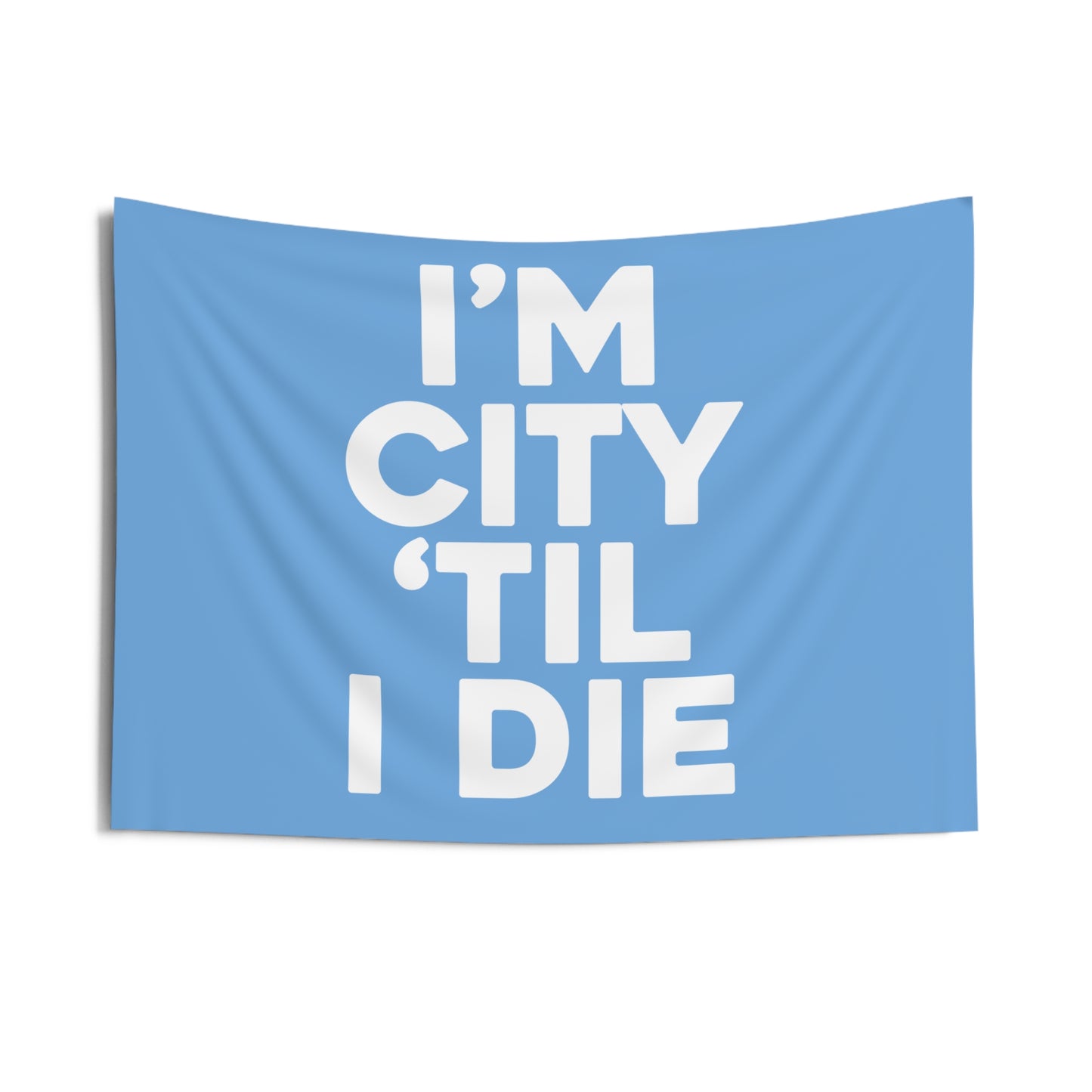 Manchester City FC team slogan banner featuring the phrase 'I'm City 'til I Die' in bold white text on a sky-blue background, expressing unwavering fan loyalty and dedication