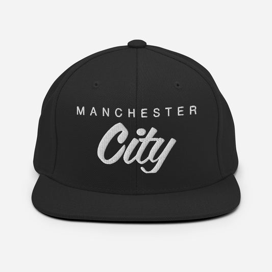 Vintage Manchester City FC snapback hat featuring a retro design on the front of a flat bill, and an adjustable strap for a custom fit, perfect for soccer fans and collectors