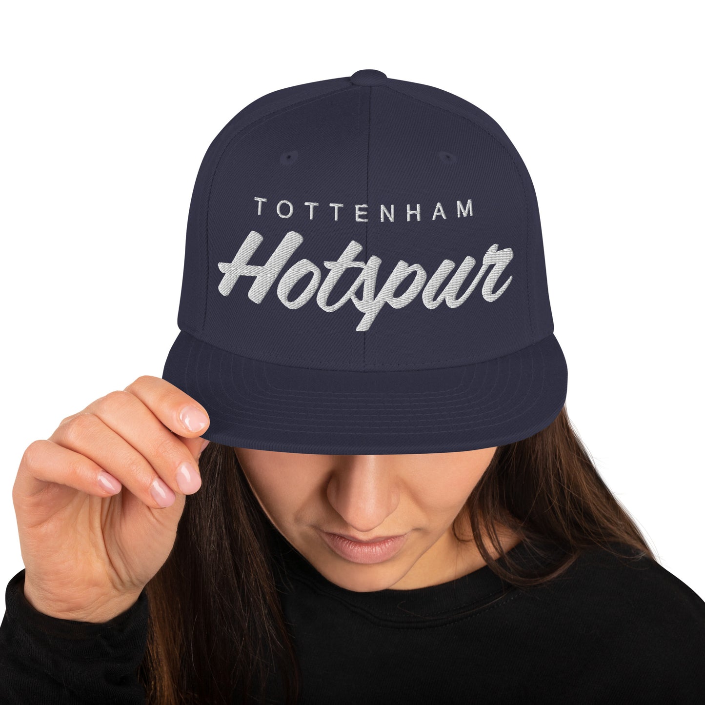 Vintage Tottenham Hotspur FC snapback hat with a retro design featuring the club's name embroidered on the front of a flat bill with an adjustable strap, showcasing official fan gear for Spurs supporters