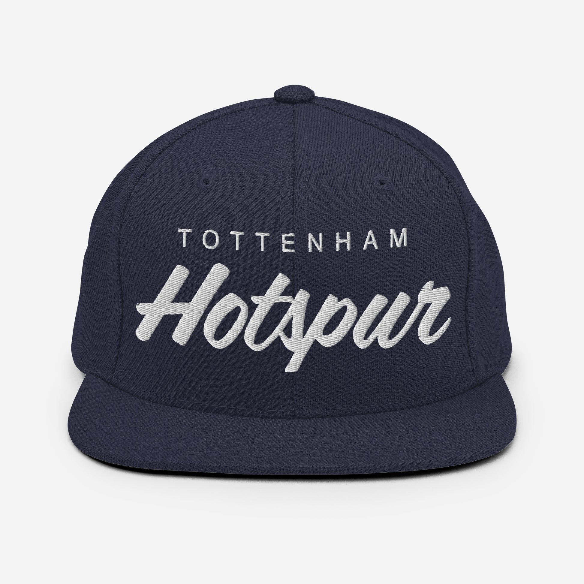 Vintage Tottenham Hotspur FC snapback hat with a retro design featuring the club's name embroidered on the front of a flat bill with an adjustable strap, showcasing official fan gear for Spurs supporters