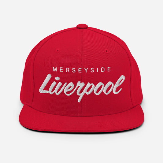 Red vintage Merseyside Liverpool FC snapback hat featuring a retro design with the club's name embroidered on the front of a flat bill cap, complete with an adjustable strap, showcasing official fan gear for Liverpool supporters