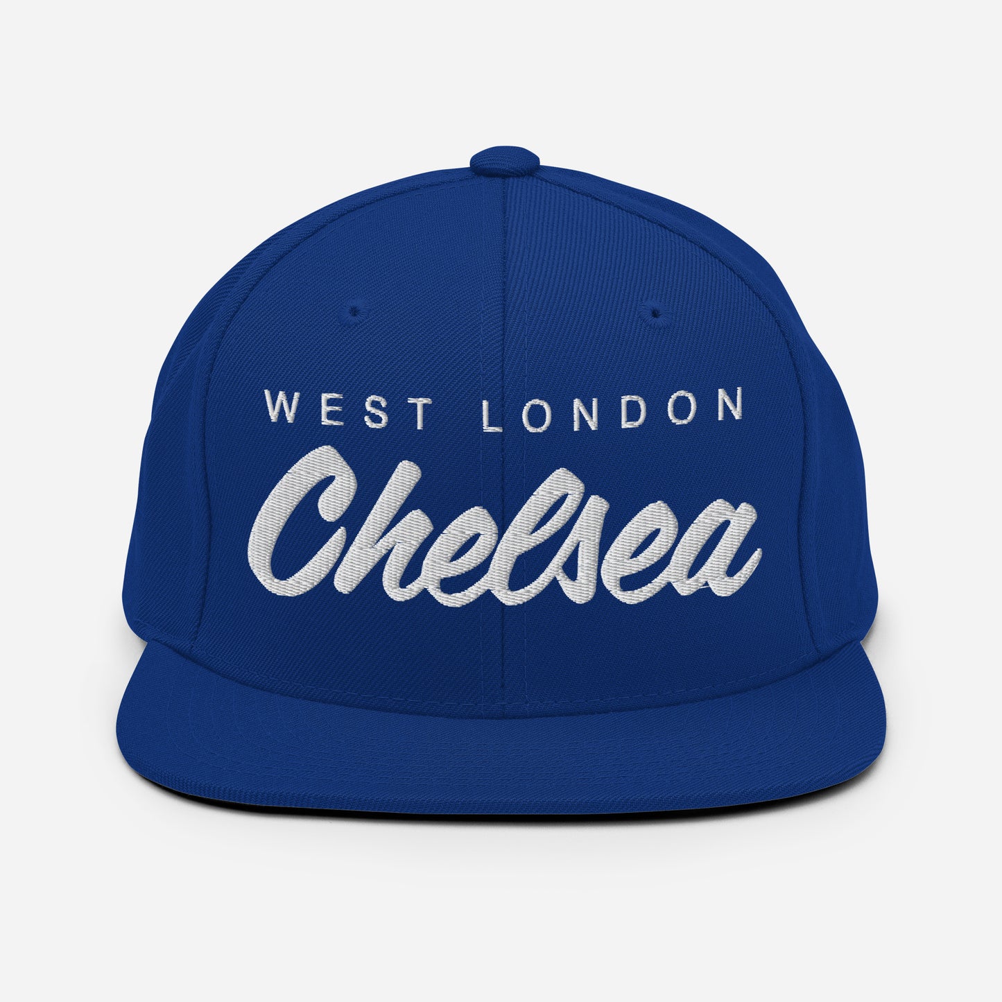 Blue vintage West London Chelsea FC snapback hat featuring a retro design with the club's name embroidered on the front of a flat bill cap, complete with an adjustable strap, showcasing official fan gear for Chelsea supporters